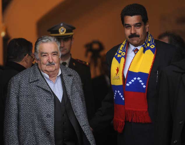 Mujica y Maduro. / AFP. 
