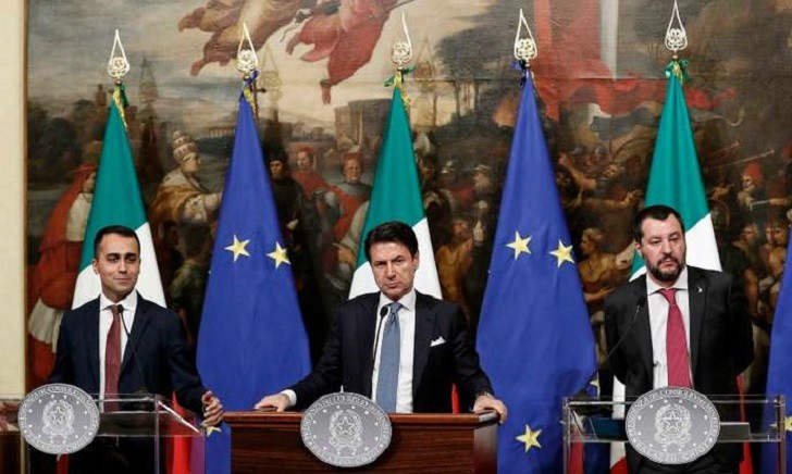 Italian Premier Giuseppe Conte, center, Deputy Premier and Labour and Industry Minister Luigi Di Maio, left, and Deputy Premier and Interior Minister, Matteo Salvini, attend a press conference following a Cabinet meeting at Chigi Palace's premier office in Rome, Thursday, Jan. 17, 2019. The government unveiled details of how it will fulfill two core campaign promises: providing a basic income to needy Italians looking for work, and reforming unpopular pension regulations.  (Riccardo Antimiani/ANSA via AP)
