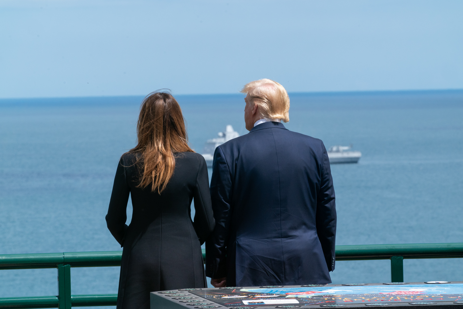 President Donald J. Trump and First Lady Melania Trump stand on the Omaha Beach overlook during the 75th Commemoration of D-Day Thursday, June 6, 2019, at the Normandy American Cemetery in Normandy, France. (Official White House Photo by Andrea Hanks)