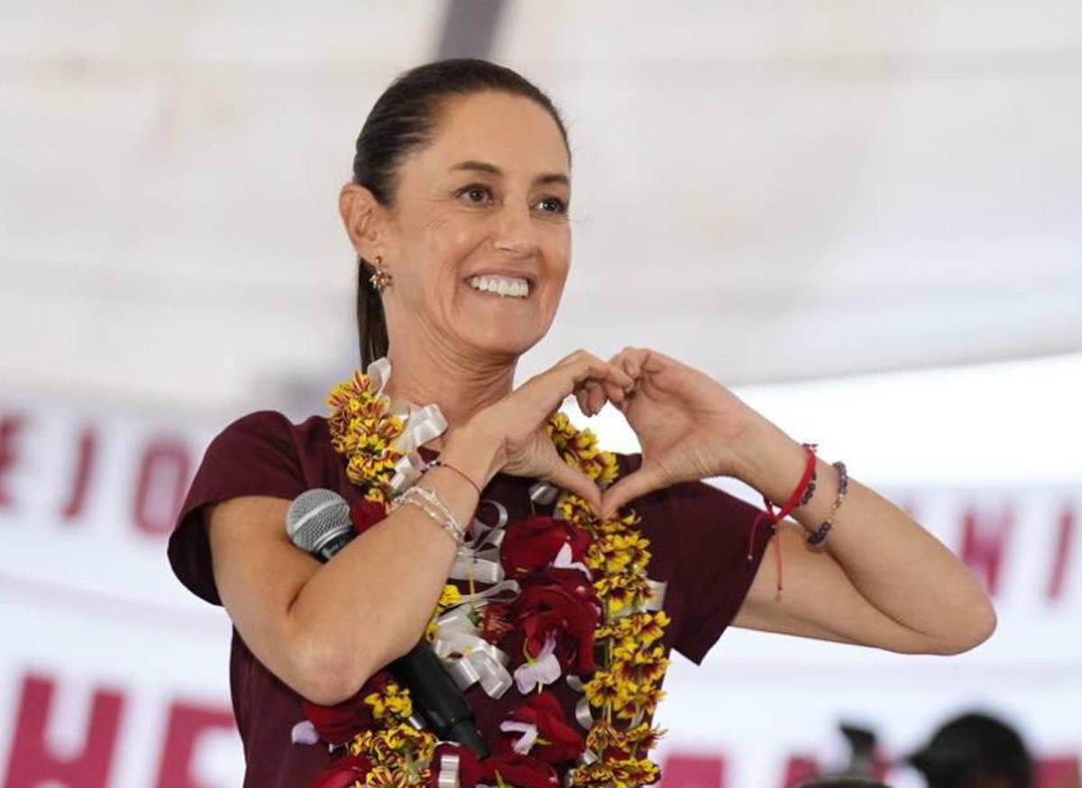 Claudia Sheinbaum haciendo el reconocido gesto de corazón, que ya forma parte de su simbología asociada.