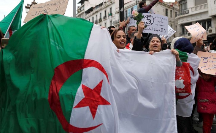 People protest against Algeria's President Abdelaziz Bouteflika, in Algiers, Algeria March 8, 2019. The sign reads: "No to the fifth term." REUTERS/Zohra Bensemra